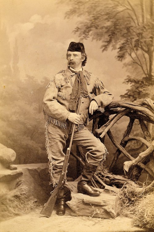 studio-portrait-of-George-Armstrong-Custer.-Custer-is-wearing-buckskins-and-a-fur-cap.-He-is-holding--Springfield-rifle-in-right-hand-1872-LIBI-NPS_scaled.thumb.jpg.99194e1e8c55f946617e7edcd163ba17.jpg